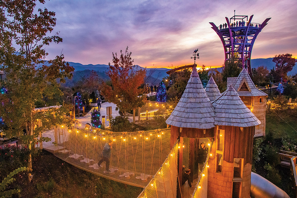 Person walking over illuminated suspension bridge at sunset at Gatlinburg, Tennessee’s Anakeesta Mountaintop Adventure Park (photo courtesy of Anakeesta Mountaintop Adventure Park) Person walking over illuminated suspension bridge at sunset at Gatlinburg, Tennessee’s Anakeesta Mountaintop Adventure Park (photo courtesy of Anakeesta Mountaintop Adventure Park)