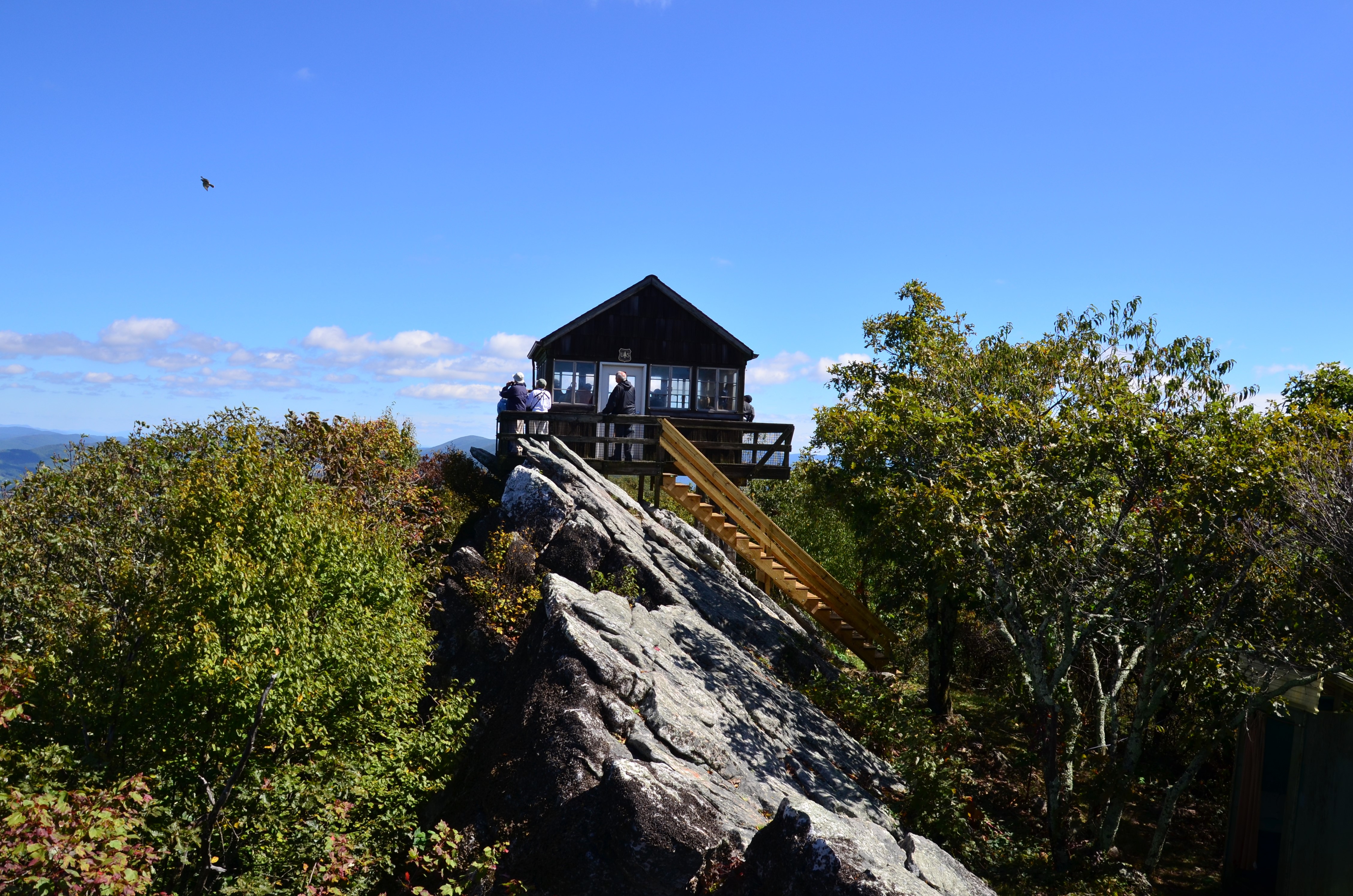 People looking out of Hanging Rock Raptor Observatory in Waiteville, West Virginia (photo by Sharyn Ogden) People looking out of Hanging Rock Raptor Observatory in Waiteville, West Virginia (photo by Sharyn Ogden)