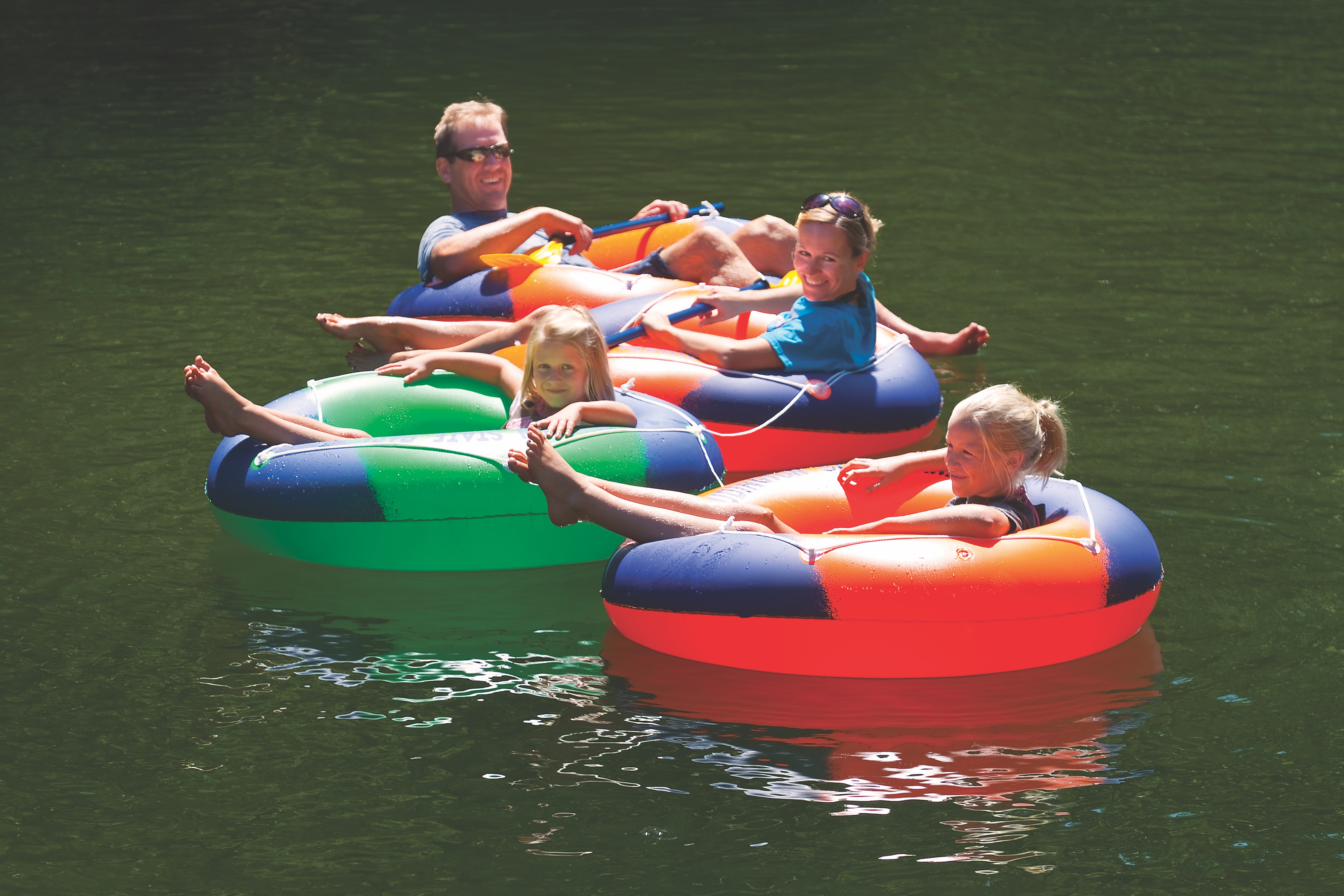 Family floating in inner tubes on the Big Sable River in Ludington, Michigan (photo by Todd Reed) Family floating in inner tubes on the Big Sable River in Ludington, Michigan (photo by Todd Reed)